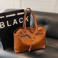 Brown retro oil-waxed leather tote bag with long shoulder straps on a sofa - Dark Brown