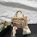Mini handbag in beige leather and leopard print with long tassels and metallic zip - Khaki