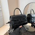 Minimalist black quilted glossy handbag with adjustable shoulder strap and gold hardware - Black
