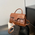 Brown handbag with chocolate-style embossed square pattern and glossy leather finish - Dark Brown