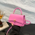 Minimalist neon pink crossbody handbag with smooth leather finish and gold buckle - Pink