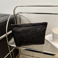 Elegant black satin-like pouch featuring detailed butterfly embroidery for cosmetics. - Black