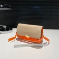 Orange and beige color-block crossbody bag with circular gold metal lock and leather strap - Orange