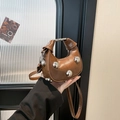 Brown heart-shaped mini bag with silver studs and top handle for shoulder or crossbody use - Dark Brown