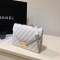 White quilted chain shoulder bag with V-shaped stitching and golden metal clasp - White