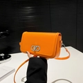 Minimalist orange leather crossbody bag with silver clasp and slim shoulder strap - Orange
