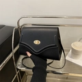 Minimalist black flap crossbody bag with premium matte texture and gold oval twist lock - Black
