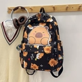 Cute black backpack featuring capybara cartoon prints for school and travel - Black
