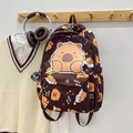 Cute dark brown backpack featuring cartoon capybara prints and large character illustration - Dark Brown