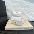White quilted mini shoulder bag with large bow detail and gold chain strap - White