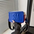 Blue and red crossbody camera bag with SM embossed logo and striped wide shoulder strap - Blue
