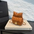 Quilted mini crossbody bag in vibrant orange with bow detail and golden chain strap - Caramel color