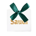 Close-up of white Saudi gift box with golden foil palm tree and dark green satin bow - White Box / Green Ribbon