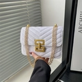 White quilted velvet crossbody bag with elegant gold chain strap and geometric metal clasp - White