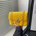 Bright yellow velvet crossbody bag with V-quilted pattern and gold chain strap - Yellow