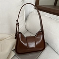 Retro dark brown patent leather shoulder bag with adjustable strap on white textile - Tan
