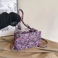 Fashionable purple snakeskin textured crossbody bag with round charm and woven handle - Main Bag and Round Pouch Set / Purple