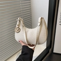 White woven crescent shoulder bag with golden M charm and minimalist PU leather texture - White