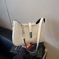 Chic cream woven baguette bag with white leather trim and silver chain shoulder strap - White