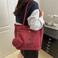 Burgundy tote bag with cartoon bear print and matching round coin purse on shoulder - Red