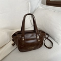 Deep brown vintage leather bucket bag with gold rivets and adjustable strap for women - Brown