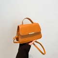 Quilted caramel leather handbag for women featuring a top handle and adjustable strap - Brown