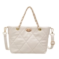 Chic cream-white quilted bucket bag with gold chain strap and elegant metal twist lock - White
