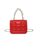 Mini red heart-embossed crossbody bag with elegant faux pearl handle and gold chain strap - Red
