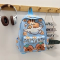 Macro shot of sky blue kids backpack featuring cute capybara patterns and side pockets - Light Blue
