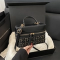 Borsa a secchiello retrò in tweed nero con patchwork in pelle e tracolla a catena oro - Nero