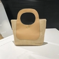 Handmade woven straw tote bag with contrast leather trim and circular cutout handles - Khaki
