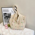 Beige crochet tote bag with colorful faux pearl embellishments and spacious woven handle - White