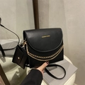 Classic black leather crossbody bag with dual gold chain detail and small pouch - Black