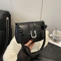 Minimalist black leather shoulder bag with silver U-shaped metal buckle and knotted strap - Black