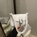 Minimalist white leather shoulder bag with a silver horseshoe metal buckle detail - White