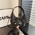 Chic black pleated crescent bag with bow detail and adjustable shoulder strap - Black