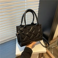Black quilted square handbag with woven texture and adjustable strap for women - Black