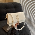 Cream white small crossbody bag with golden letter hardware and elegant tassel detail - White