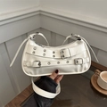 White punk-style rivet shoulder bag with silver buckle straps and metal eyelet details - White