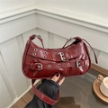 Dark red patent leather underarm bag with silver rivet straps and metal buckles - Red