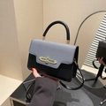 Chic two-tone gray and black contrast shoulder bag with elegant gold lock and top handle - Black