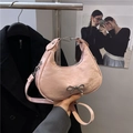 Pink bow shoulder bag in hobo style with silver metallic detail and adjustable strap - Pink