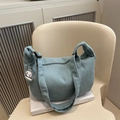 Light blue corduroy hobo bag with cute puppy pendant and soft crescent shape design - Green