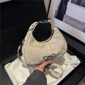 Creamy white bow shoulder bag with silver metallic detail and long leather strap - Khaki