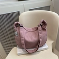 Pink waffle texture shoulder bag for women with cute white cartoon animal pendant - Pink