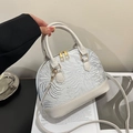 White shell-shaped Boston bag featuring elegant silver embroidery and gold hardware - Silver Thread Embroidery / Gray