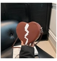 Close-up of heart-shaped brown PU leather crossbody bag with white lightning print pattern - Coffee