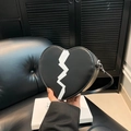 Fashionable black heart-shaped crossbody bag with white lightning graphic and silver zipper - Black