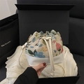 Sac seau en jacquard floral et cuir blanc avec cordon et anneaux en métal doré - Blanc