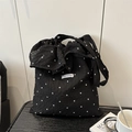 Black floral tote bag with white daisy patterns and textured bubble gauze fabric finish - Black